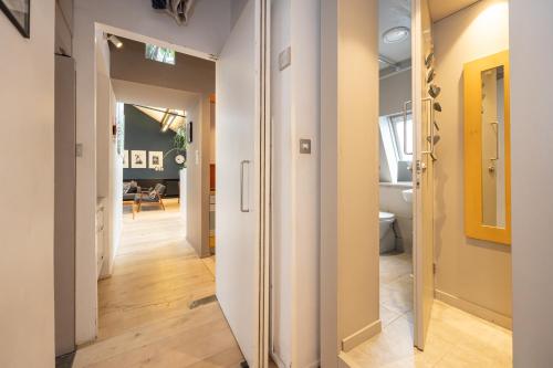 a hallway leading into a living room with a hallway at Central and Quirky Northern Quarter Flat, Manchester in Manchester