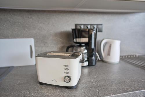 a toaster sitting on top of a kitchen counter at Bohemian Glow of Krumlov in Český Krumlov