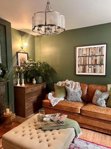 a living room with a couch and a table at 6 Luxury home near family park Pet friendly in Merthyr Tydfil