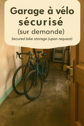 a bike parked in a room with a sign above it at Appartement, terrasse & barbecue in Dieppe
