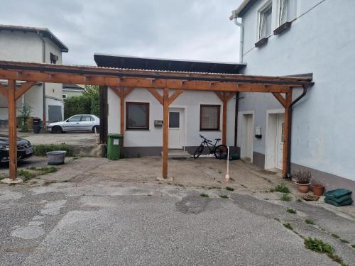 a garage with awning next to a building at Gudzevic - FU A 2 in Gloggnitz