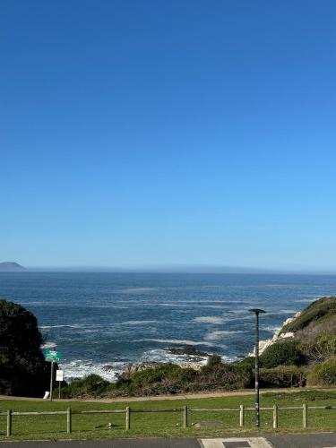 a view of the ocean from a road at Hermanus Boutique Guest House in Hermanus