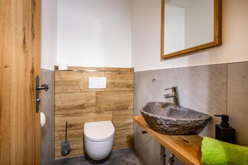 a bathroom with a sink and a toilet at Lacklehen in Ramsau