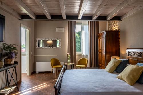 Postel nebo postele na pokoji v ubytování Relais Corte Baruzzo