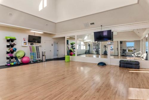a large room with a dance floor and a flat screen tv at PC Beach in Manteo