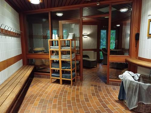 a room with a store with glass doors and a shelf at Filipstad, Lake House Fishing, Nature, Beach in Filipstad