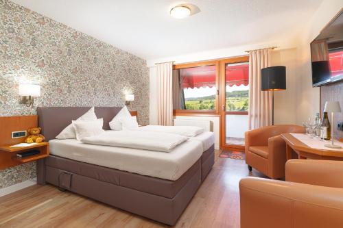 Postel nebo postele na pokoji v ubytování Hotel Zehnthof