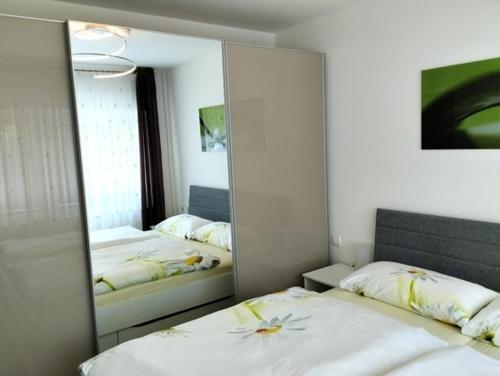 Ένα ή περισσότερα κρεβάτια σε δωμάτιο στο Ferienhaus Ferienwohnung Schöneberg