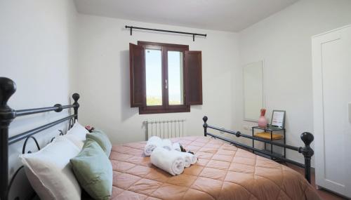 Postel nebo postele na pokoji v ubytování Sasso Regino Tuscany Apartment