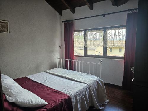 Postel nebo postele na pokoji v ubytování Il Drago Del Lago - Holiday Home