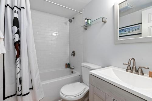 a white bathroom with a toilet and a sink at Northridge 07 With Wintergreen Advantage in Roseland