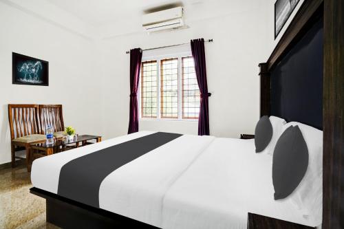 ムンナルにあるHotel O Stay Maxのギャラリーの写真