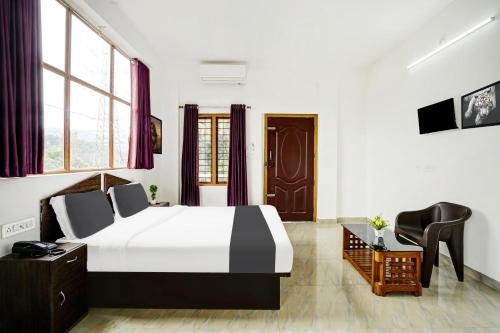 ムンナルにあるHotel O Stay Maxのギャラリーの写真