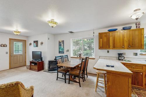 a kitchen and dining room with a table and chairs at Jewel Chalet in Girdwood