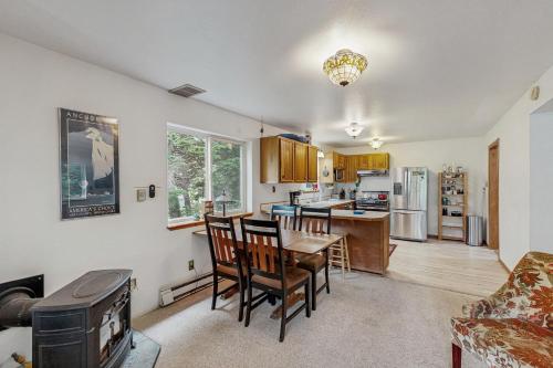 a kitchen and dining room with a table and chairs at Jewel Chalet in Girdwood
