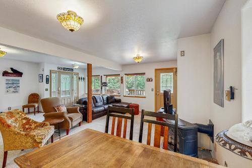 a living room with a table and a couch at Jewel Chalet in Girdwood