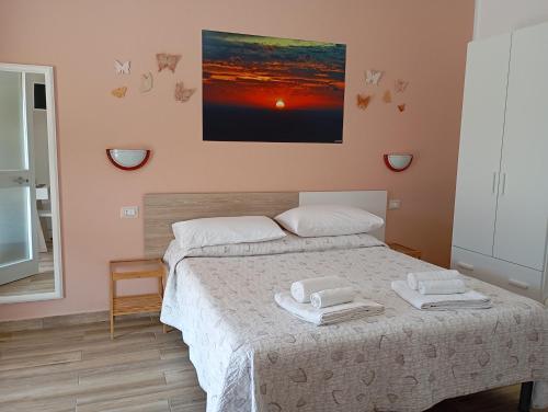 A bed or beds in a room at B&B da AnnaMaria