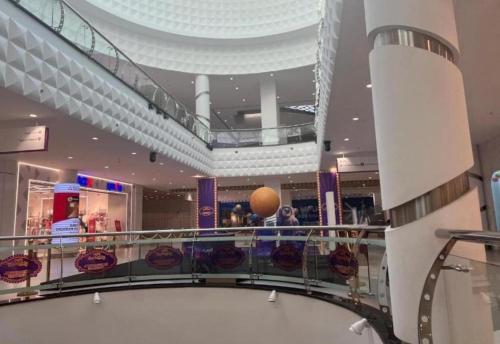 a shopping mall with a basketball on the ceiling at international hoste in Muscat