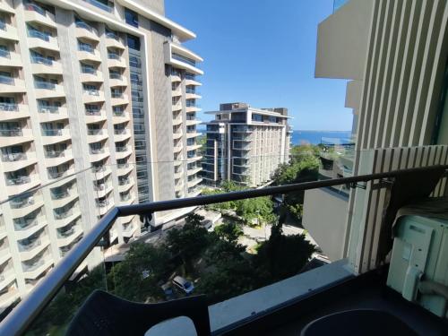 an apartment balcony with a view of buildings at Brenttstaycation at Tambuli Living Tower C,10D unit in Lapu Lapu City