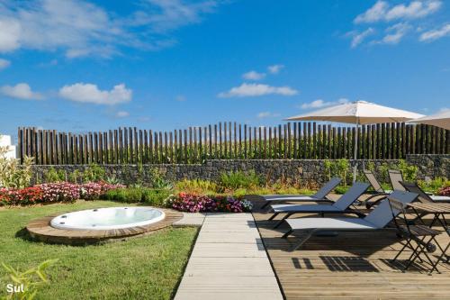 Κήπος έξω από το Mónaco Suites & Garden