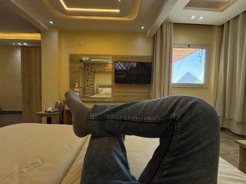 Hassan Pyramids Hotel&Rooftopにあるテレビまたはエンターテインメントセンター