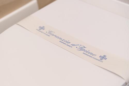 a piece of paper with a bookmark on top of a envelope at Partenope's House in Ercolano