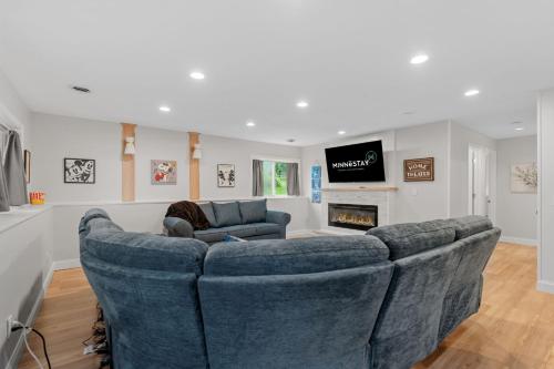 a living room with a couch and a fireplace at Meadows Retreat in Saint Michael