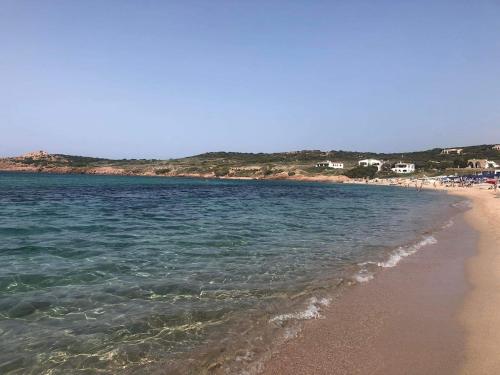 a view of a beach with the ocean at Sea View House on the Gulf of Asinara in Badesi