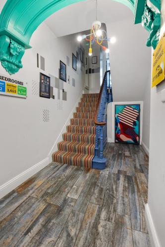 a staircase in a building with a blue ceiling at 44 North in Londonderry County Borough