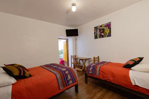 Cama o camas de una habitación en Andes House Cusco