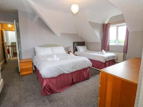 a hotel room with two beds in a room at Fern Lee in Carlisle