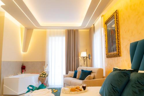 a living room with a couch and a room with a tub at Partenope's House in Ercolano