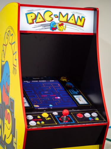 a pinball machine with a rock n roll game at Stylish Home - Game Room - Wet Bar - Sleeps 9 - Outdoor in South Euclid
