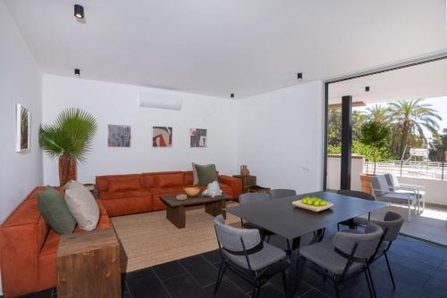 a living room with a couch and a table at Bridge House 201 - 3BR Penthouse in Limassol