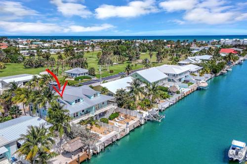 an aerial view of a resort on the water at Sunny Waterfront Key Colony 3BR 3BA Villa w Dock in Key Colony Beach