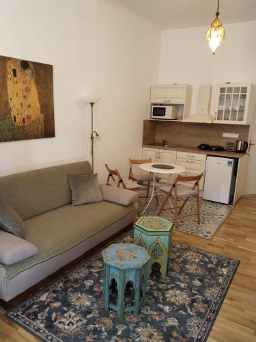 a living room with a couch and a table at Leier apartments in Piešťany