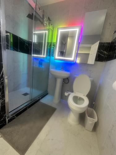 a bathroom with a toilet and a shower and a sink at Awesome deal! Room with private bathroom close to Kia Forum, Sofi Stadium and LAX airport in Inglewood