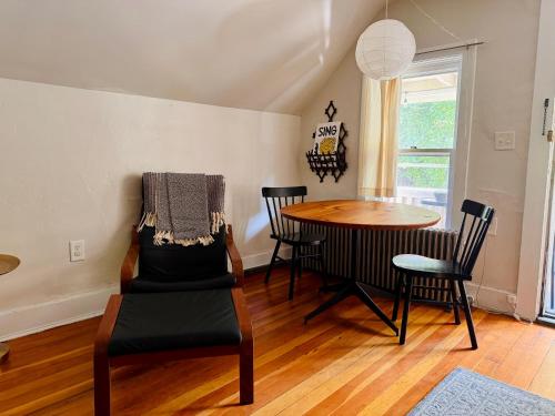 a dining room with a table and chairs at Cozy 1BD in Burlington’s Coolest Neighborhood in Burlington