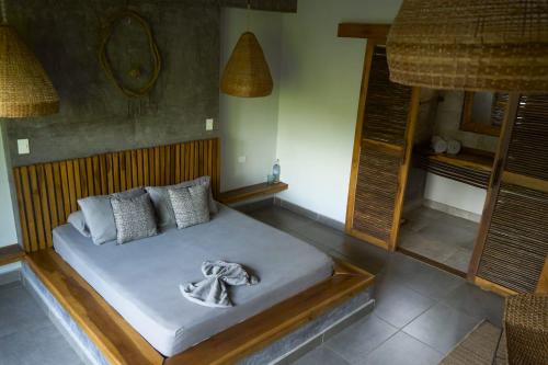 a bedroom with a bed with a towel on it at Villa Eden Palomino in Palomino