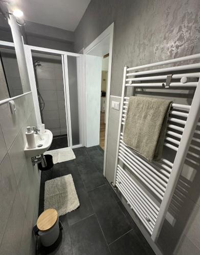 a bathroom with a sink and a toilet and a mirror at penzion LILIE in Litomyšl