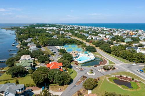 an aerial view of a small town next to the ocean at Its All Good In Corolla in Corolla
