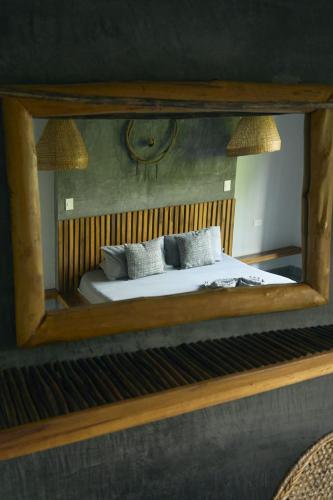 a mirror reflection of a bed in a bedroom at Villa Eden Palomino in Palomino