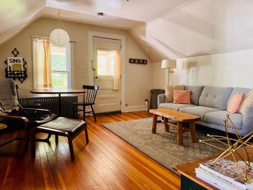 a living room with a couch and a table at Cozy 1BD in Burlington’s Coolest Neighborhood in Burlington