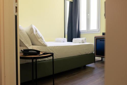 Katil atau katil-katil dalam bilik di JR Hotels Hermes Firenze