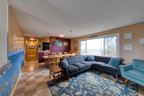 a living room with a couch and a dining room at HI Point Montara Lighthouse in Montara