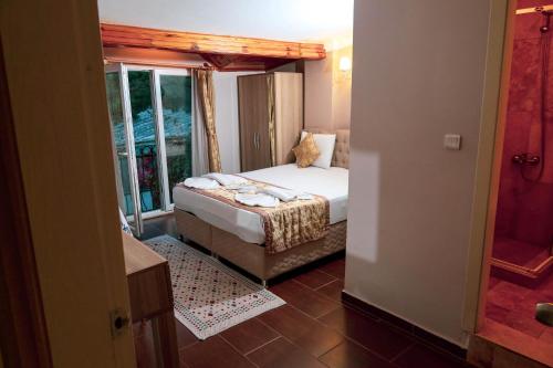 Postel nebo postele na pokoji v ubytování Ağva Carpediem Otel