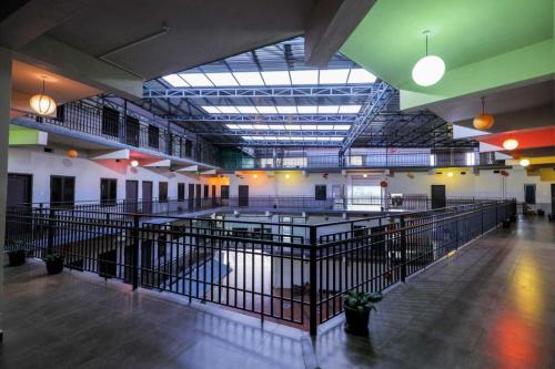a large room with a large facility with pens at Wayanad West Residency in Kalpetta