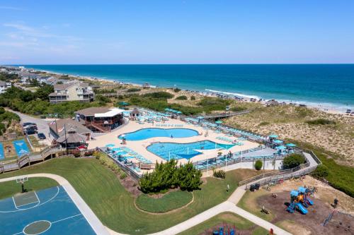 an aerial view of a pool at the beach at Let Me Count The Waves in Corolla