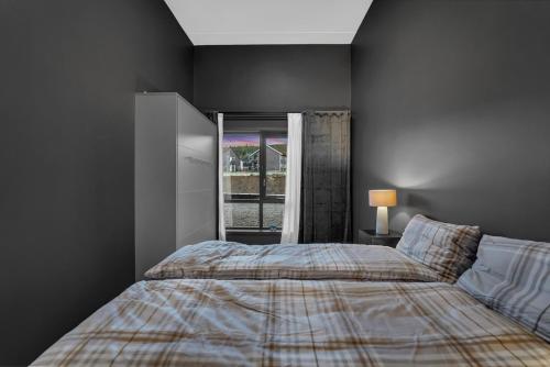 a bedroom with a bed and a window at New Nice apartment Trysil alpine lodge with the lift right outside in Trysil