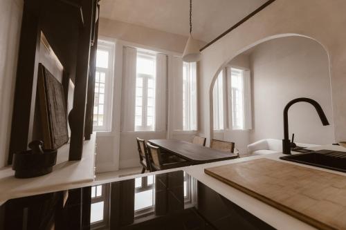 a kitchen with a sink and a counter top at Beige Tranquil Escape by the Sea in Matosinhos